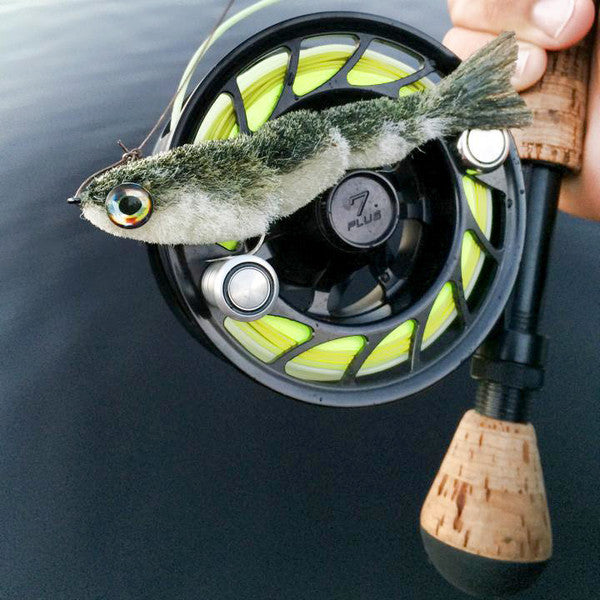 https://flymenfishingcompany.com/cdn/shop/collections/Fish-Skull_Articulated_Fish-Spine_game_changer_on_reel.jpg?v=1445953405